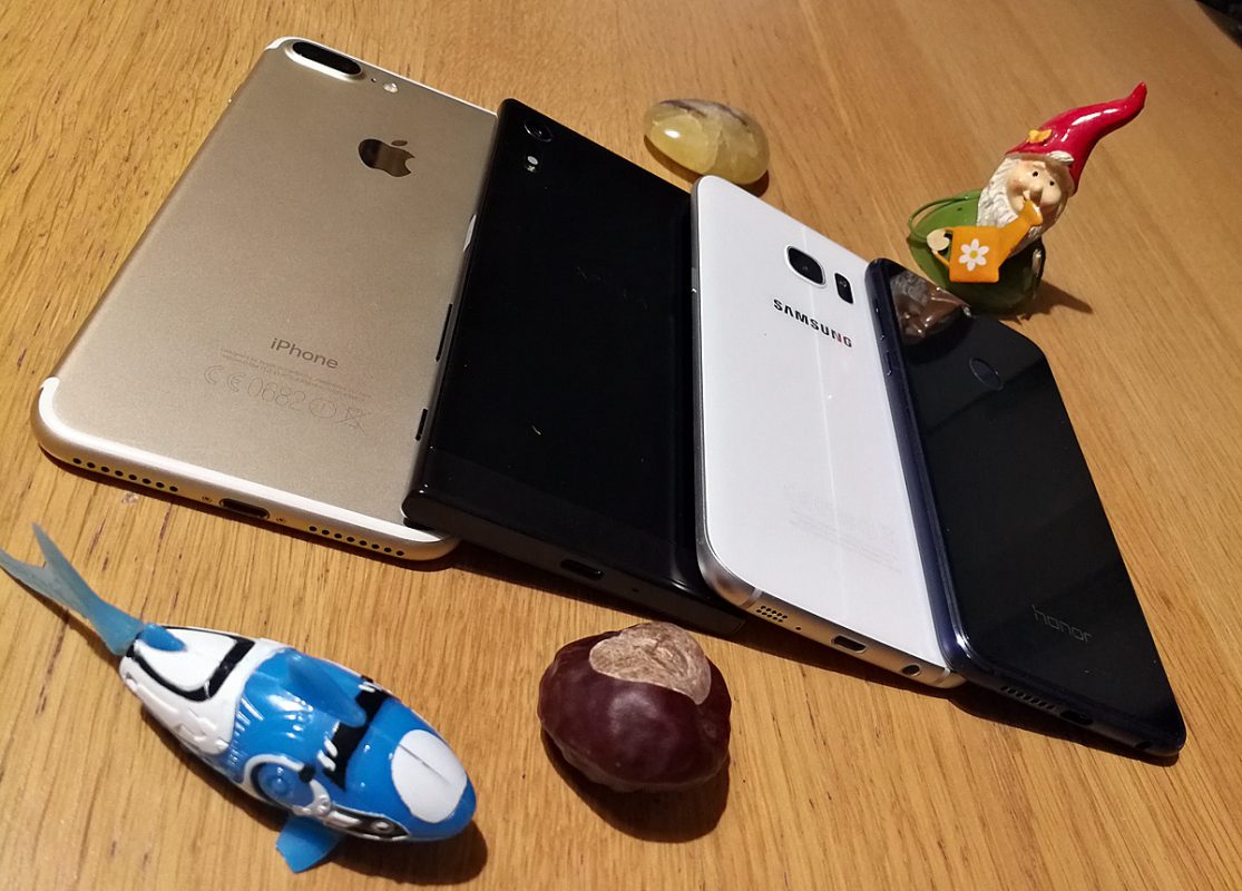 Apple iPhone 7 Plus vs Sony Xperia XZ vs Samsung Galaxy S7 Edge vs Honor 8. Apple iPhone 7 Plus vs Sony Xperia XZ vs Samsung Galaxy S7 Edge vs Honor 8.
